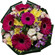 Rumba. Tight, rich round bouquet of gerbera daisies, spray roses, chrysanthemums and alstroemerias.. India